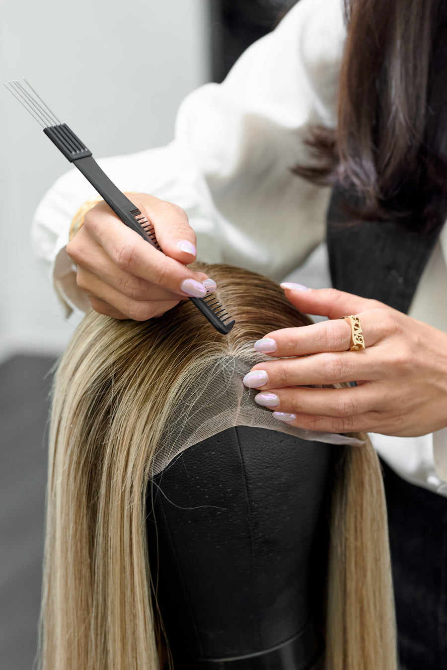 Human hair topper blended into a client's own hair